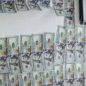 У Києві затримано фальшивомонетників, які купували гаджети за підроблені долари