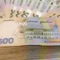 У матері працівника Господарського суду Києва знайшли $150 тис. готівки, золото та автопарк